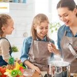 Parent and child in a kitchen filled with colorful fruits and vegetables, engaging in a positive interaction about food choices.