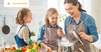 Parent and child in a kitchen filled with colorful fruits and vegetables, engaging in a positive interaction about food choices.