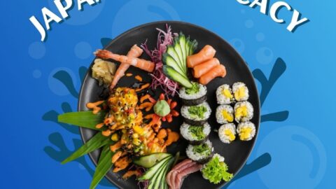 A promotional poster for "Fugu the Deadly Japanese Delicacy" featuring sushi on a black plate and a yellow pufferfish illustration in a blue underwater-themed background.