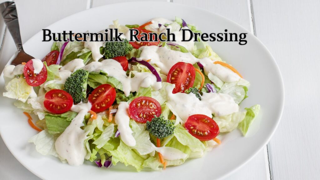 A bowl of salad with buttermilk ranch dressing.