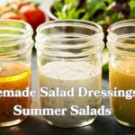 Three glass jars on a sunlit kitchen counter: orange vinaigrette, empty jar, and creamy beige dressing. Fresh veggies peek from the background. Bold text: ‘Homemade Salad Dressings for Summer Salads.’