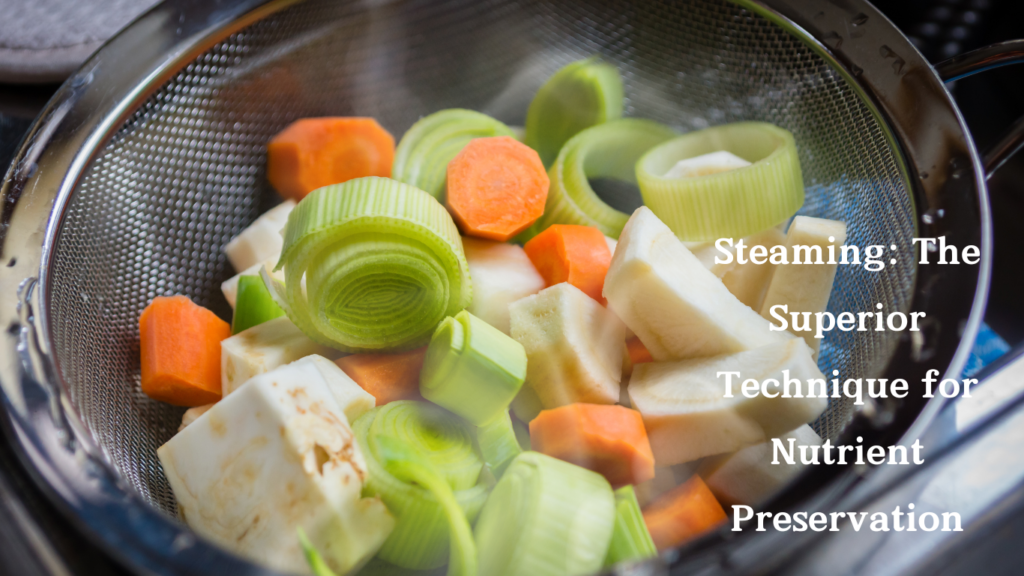 Freshly chopped carrots, leeks, and root vegetables steaming in a metal basket over boiling water.