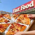 Fast food restaurant sign with people sharing a pizza.