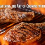 Two steaks with grill marks cooking on an open flame grill.