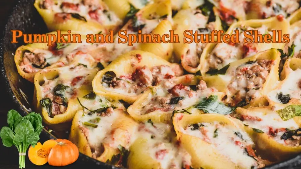 A close-up of pumpkin and spinach stuffed shells in a pan, topped with melted cheese and garnished with herbs.