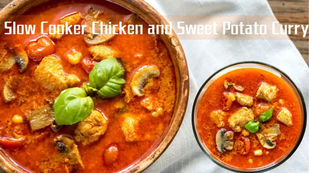 A vibrant dish of Slow Cooker Chicken and Sweet Potato Curry served in a bowl, garnished with basil leaves.