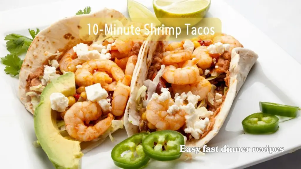 A plate of two shrimp tacos garnished with avocado slices and lime wedges, with the text “10-Minute Shrimp Tacos” and “Easy fast dinner recipes” overlaid on the image.