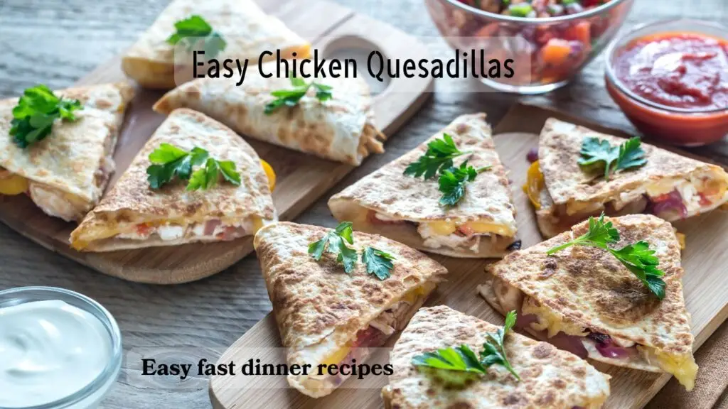 A photo of freshly made chicken quesadillas garnished with parsley on a wooden surface, accompanied by a bowl of salsa.