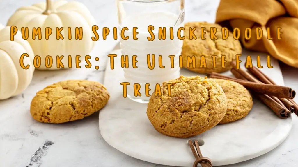 A display of pumpkin spice snickerdoodle cookies with a glass of milk, cinnamon sticks, and pumpkins in the background.