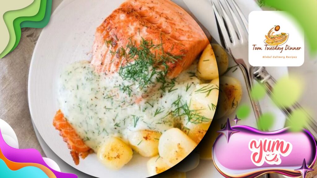 A plate of grilled salmon topped with a creamy dill sauce, accompanied by roasted potatoes, with a fork and knife placed beside the plate.