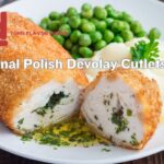 Breaded Polish Devolay Cutlet served with mashed potatoes and green peas