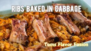 A dish of ribs baked in cabbage, garnished with caramelized vegetables.