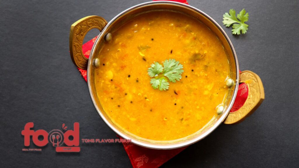 Bowl of Kerala-style Parippu Curry garnished with fresh cilantro.