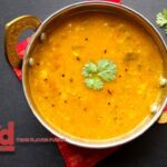 Bowl of Kerala-style Parippu Curry garnished with fresh cilantro.