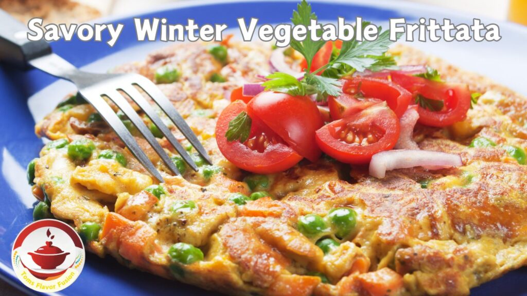 A close-up of a savory winter vegetable frittata on a blue plate, garnished with cherry tomatoes, parsley, and red onion slices. A fork is placed on the frittata.