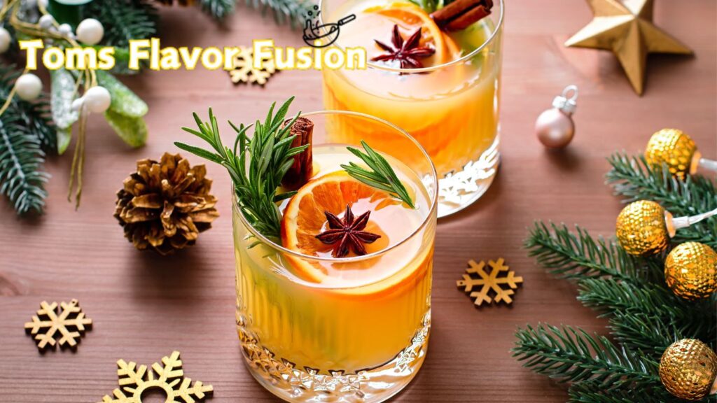 Festive holiday drinks garnished with orange slices, rosemary, star anise, and cinnamon sticks, surrounded by Christmas decorations.