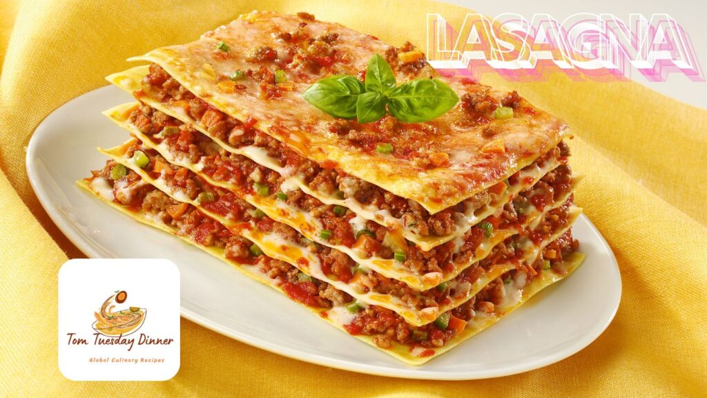 A plate of lasagna with multiple layers of pasta, meat sauce, and cheese, garnished with fresh basil leaves, placed on a yellow cloth.