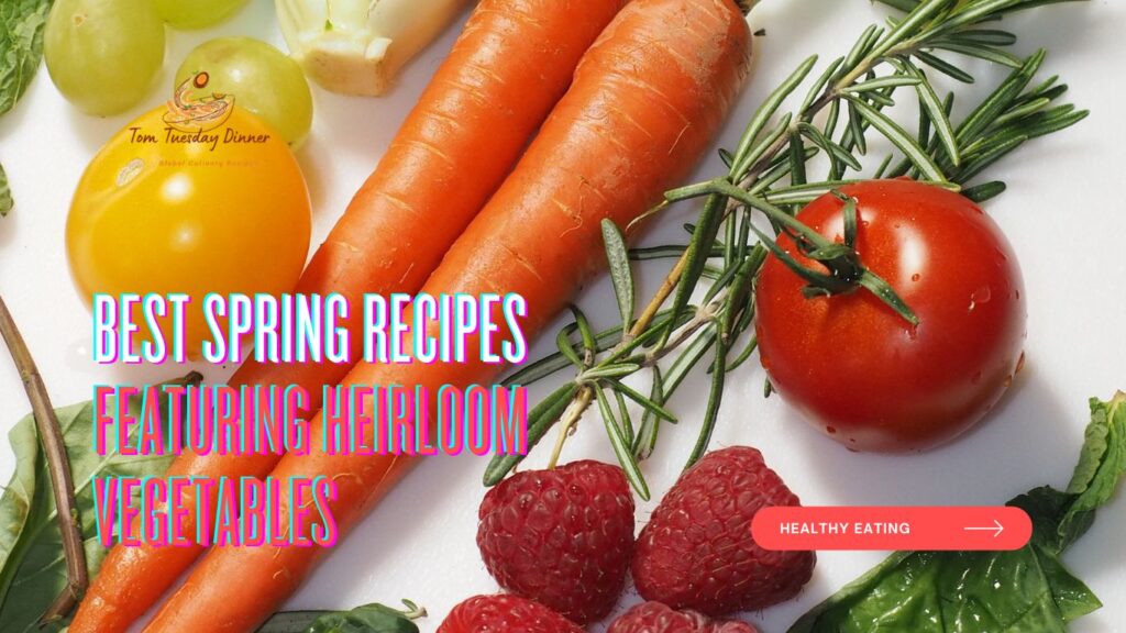 Fresh heirloom vegetables, including vibrant carrots, tomatoes, raspberries, and herbs, displayed on a white background with the text "Best Spring Recipes Featuring Heirloom Vegetables."