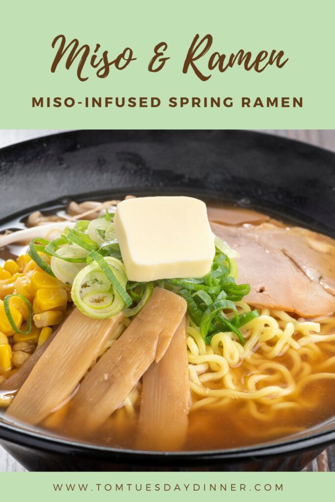 A bowl of miso-infused spring ramen topped with a pat of butter, green onions, bamboo shoots, corn, and slices of meat.