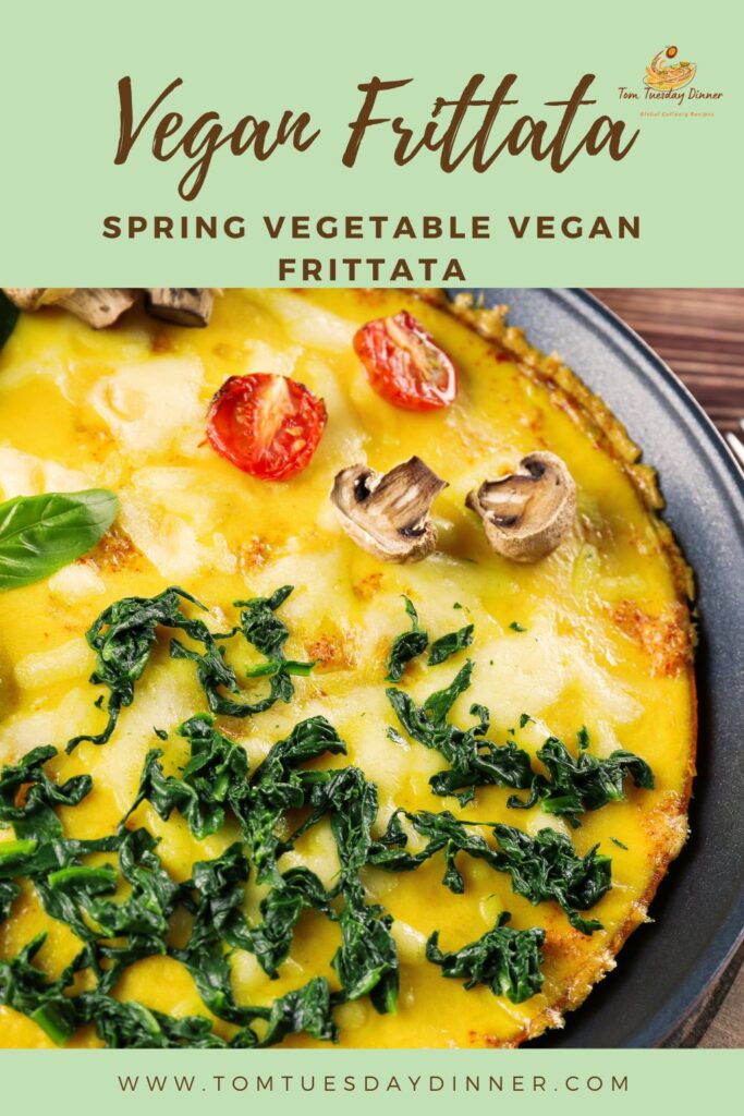 Vegan Frittata with spring vegetables including tomatoes, mushrooms, and greens.