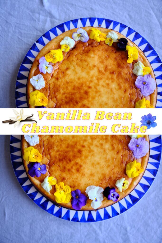 A vanilla bean chamomile cake decorated with colorful edible flowers on a blue and white patterned plate.